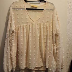 Cream flowy top size large